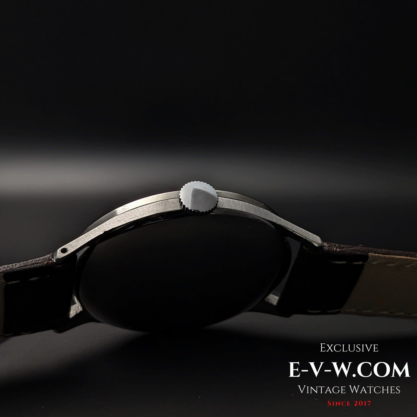 Side profile of 1955 Longines Jumbo Calatrava Ref 2849 showing slim stainless steel case and crown design.