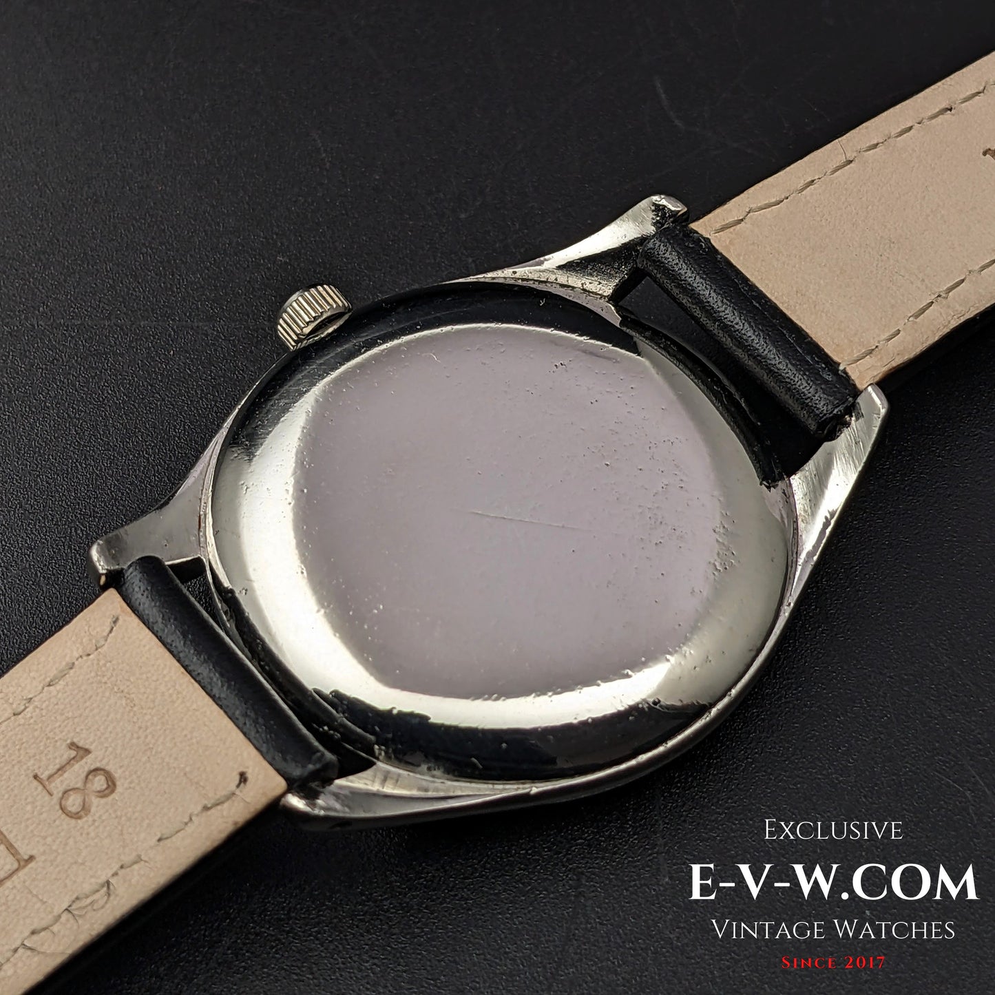 Case back of the vintage Omega Sector Jumbo wristwatch, showing its stainless steel construction and original engravings.