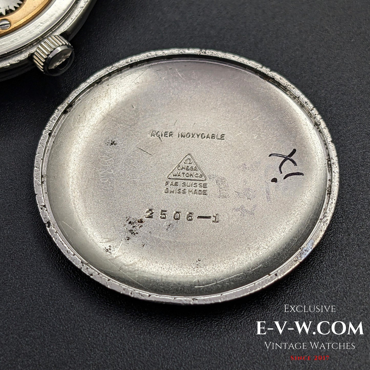 Inside case back of the Omega Sector Jumbo wristwatch, showing Omega engravings and reference number 2506 1.