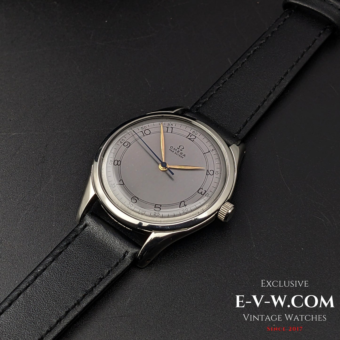 Top-down view of the Omega Sector Jumbo vintage wristwatch, highlighting its elegant design and black leather strap.
