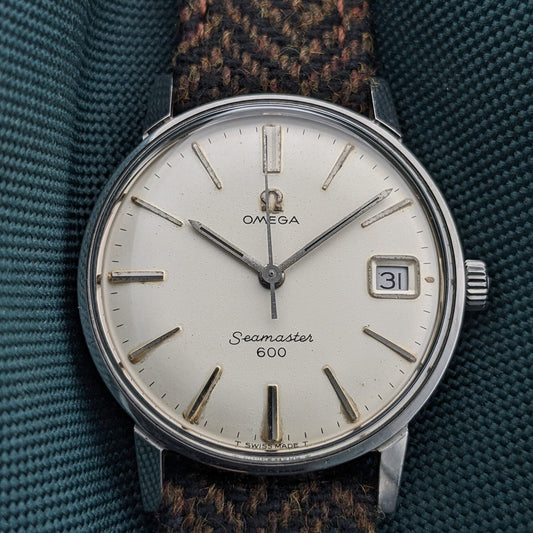 Vintage Omega Seamaster 600 showing the dial, hands and case for a pre-purchase watch assessment
