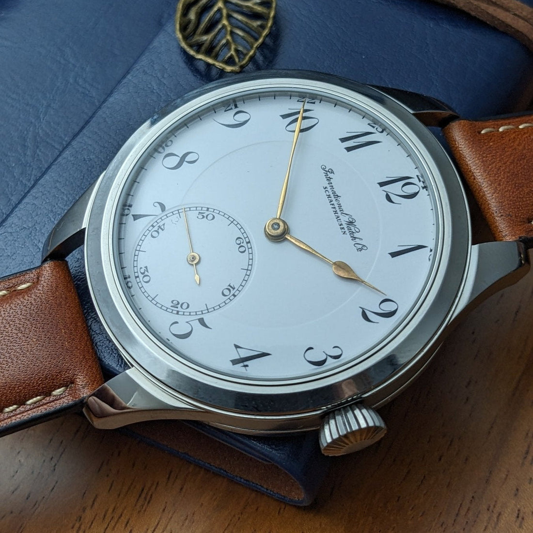 IWC marriage watch with original antique enamel pocket-watch dial in a later wristwatch case
