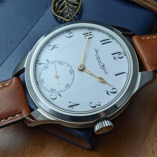 IWC marriage watch with original antique enamel pocket-watch dial in a later wristwatch case