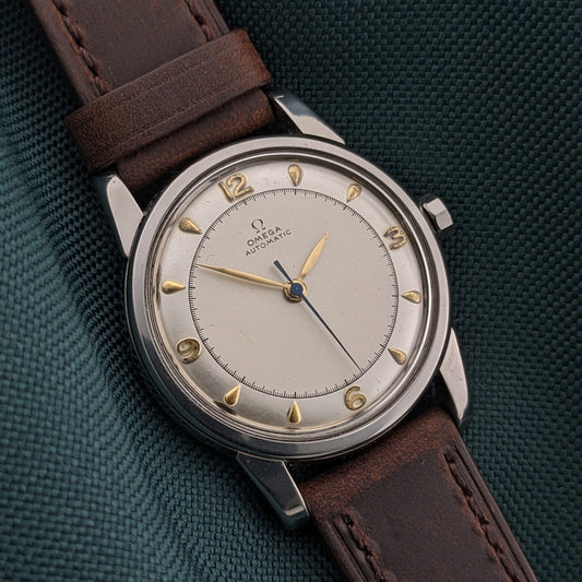 Omega Automatic Bumper reference 2767-4 SC shown dial-up with a cream dial, gold-tone Arabic numerals and teardrop hour markers.