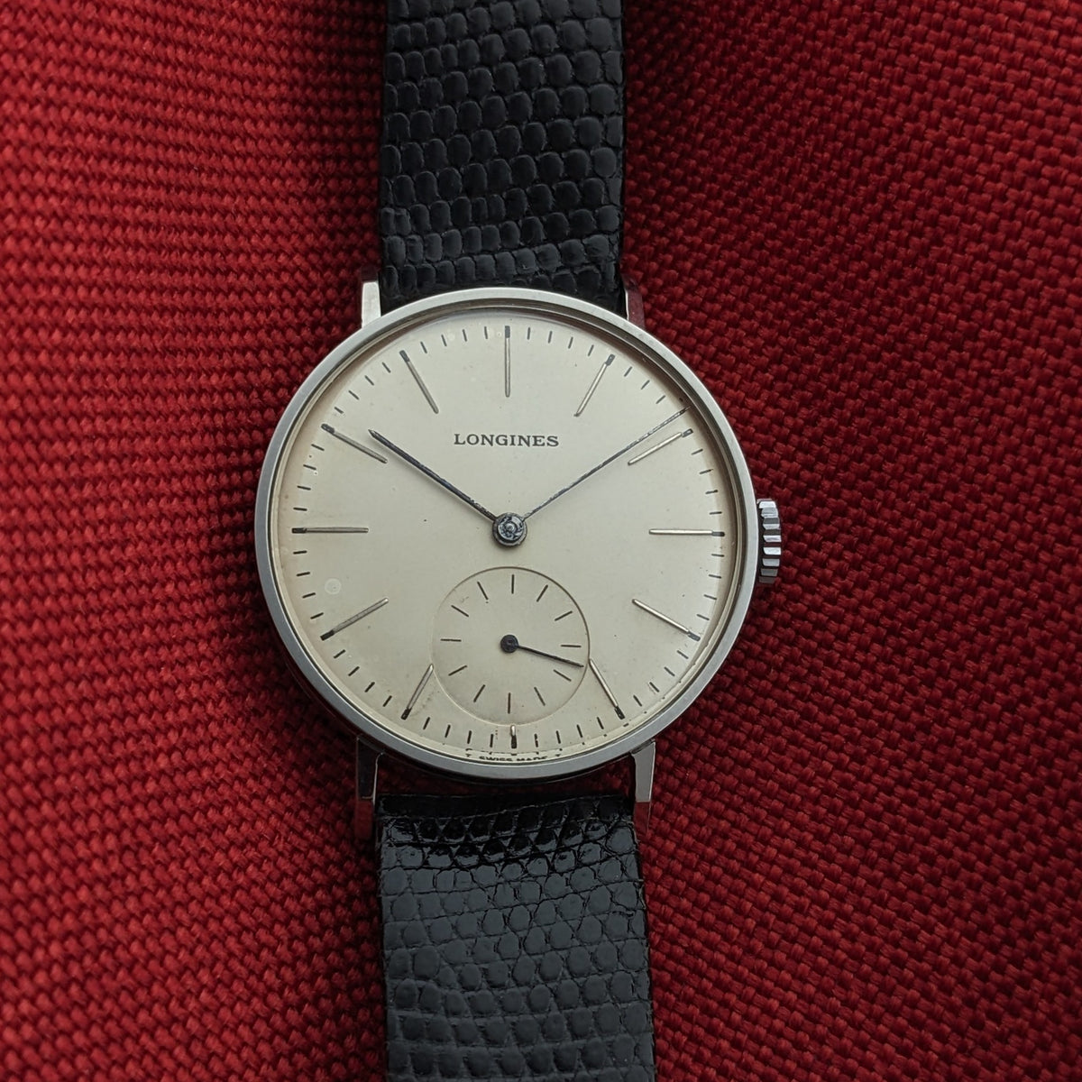 Front view of the Longines Calatrava reference 20757 with a light dial, applied hour markers, central hands, and small seconds at six o’clock.