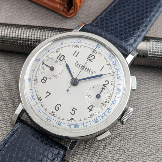 Close-up of the Eberhard & Co. Pre-Extra Fort face with blue hands, black Arabic numerals, twin subdials and blue perimeter scales.
