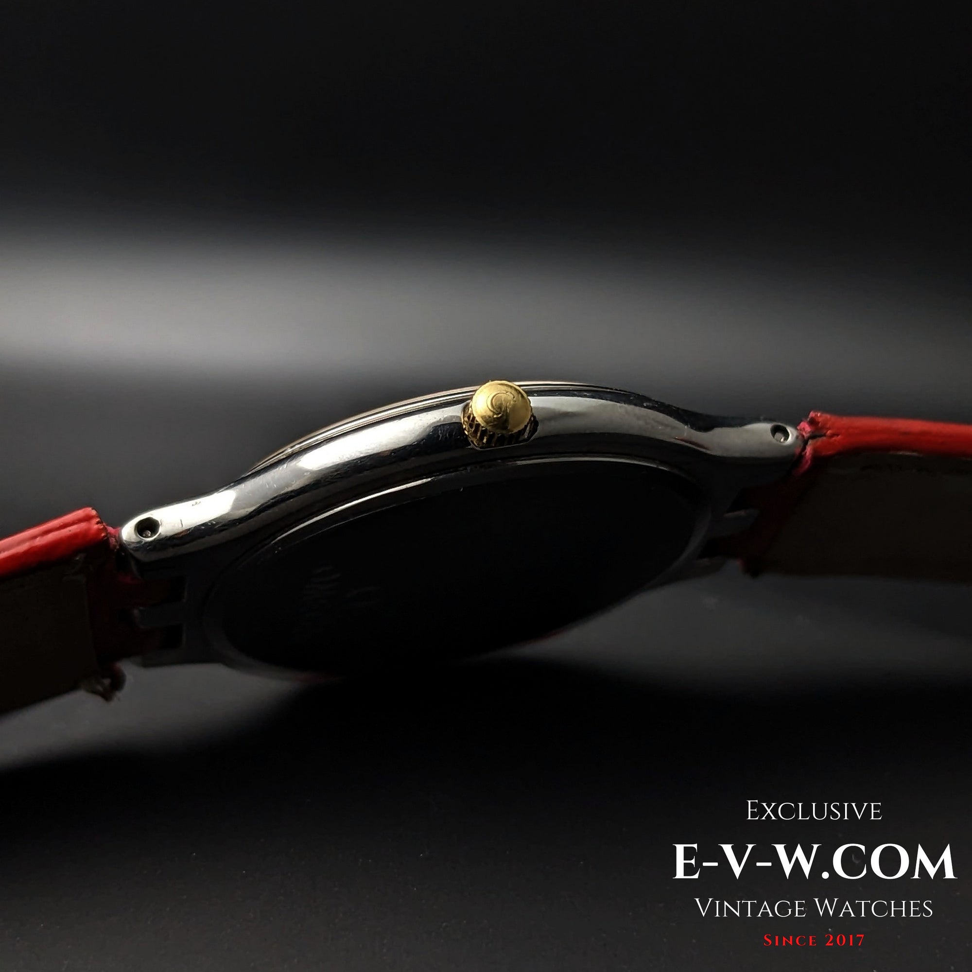 Side profile of Omega vintage watch showing gold crown and slim stainless steel case, Ref. 3961016 Cal. 1436.