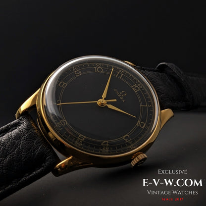 Side angle of 1944 Vintage Omega WWII Gold Watch with domed crystal and black dial, emphasizing its classic gold-plated case design.