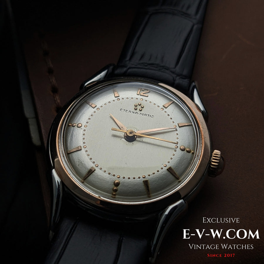 Eterna-Matic, frühes Modell mit fünf Kugeln und Automatikwerk | Zweifarbiges Gehäuse, aufwendig gestaltete Bandanstöße | Kal. 1248T | Baujahr 1950