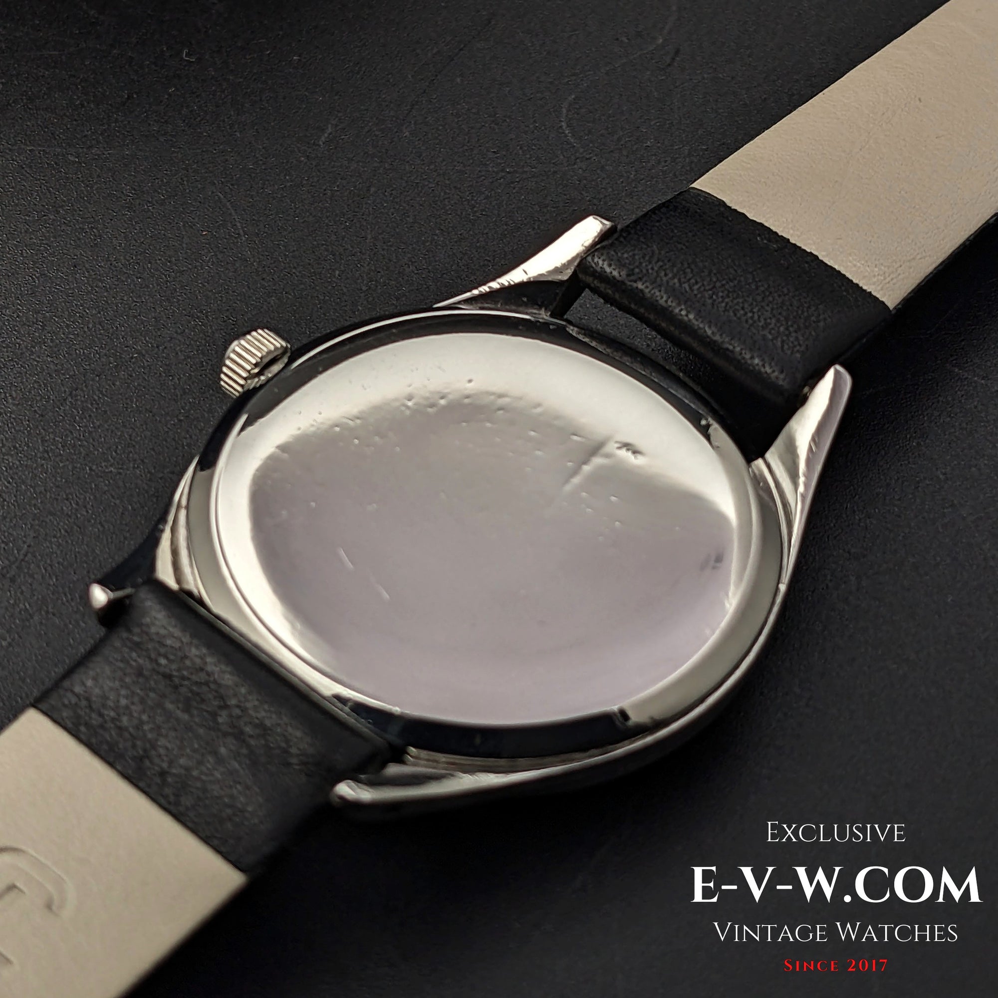 Back case of Omega Vintage 1952 Jumbo Ref. 2505 wristwatch, showing the polished steel surface with minor wear.