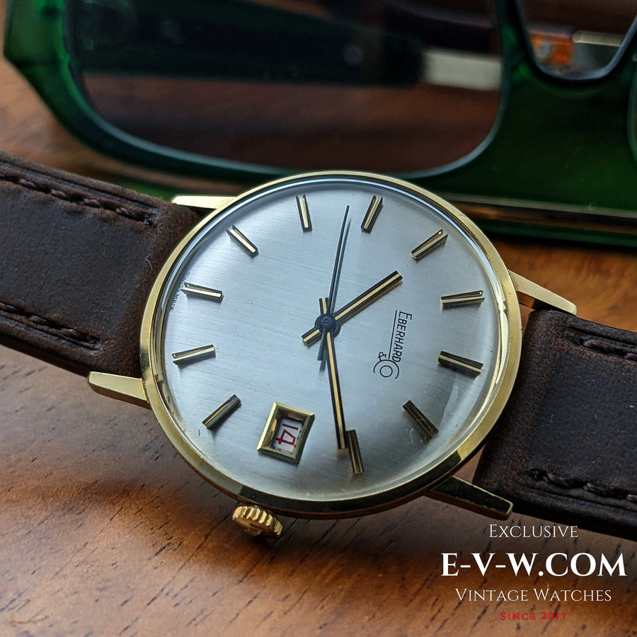 Eberhard &amp; Co. Armbanduhr aus 18-karätigem Gold aus den 1960er Jahren | Seltene Roulette-Datumsanzeige | Kal. 236-129 |