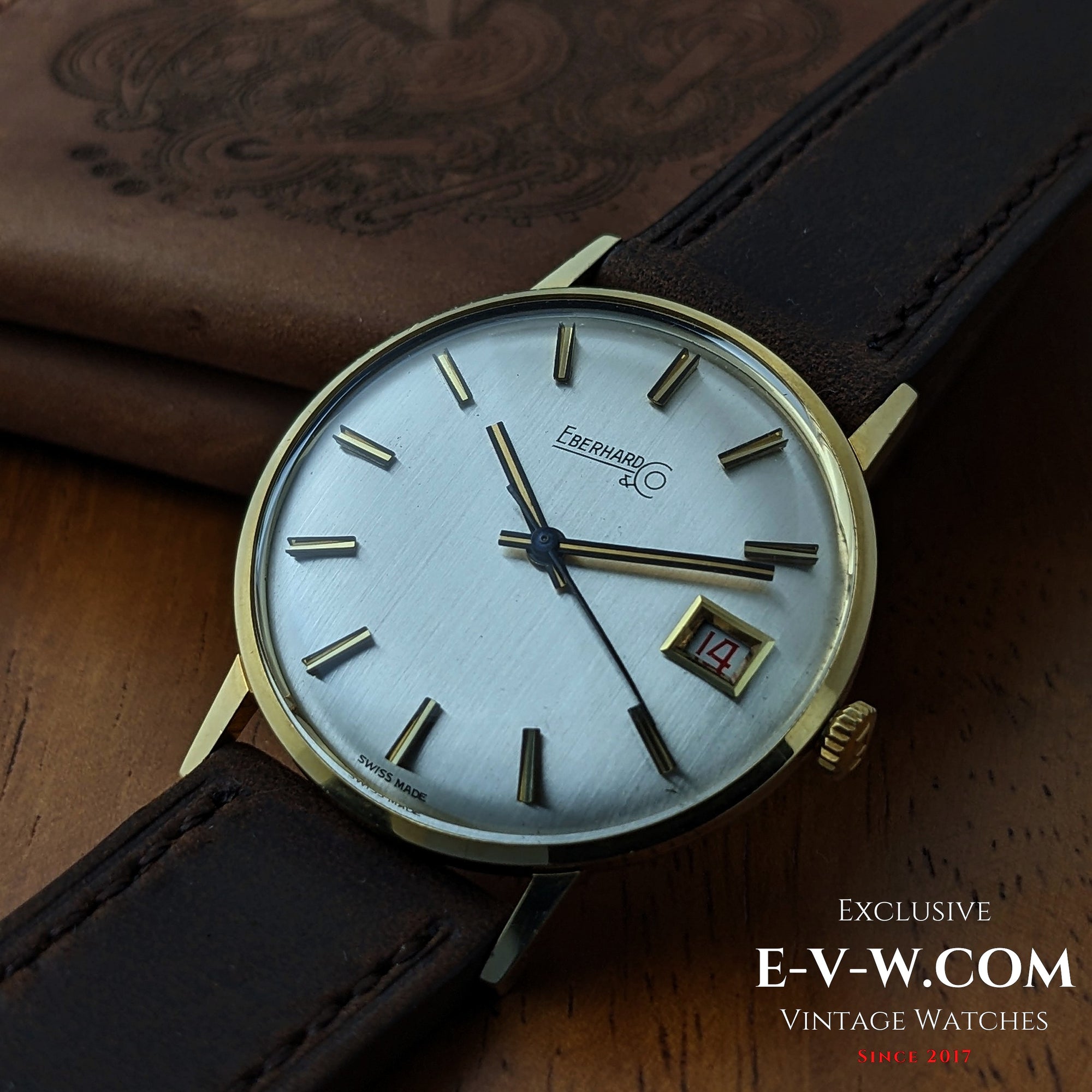 Eberhard &amp; Co. Armbanduhr aus 18-karätigem Gold aus den 1960er Jahren | Seltene Roulette-Datumsanzeige | Kal. 236-129 |