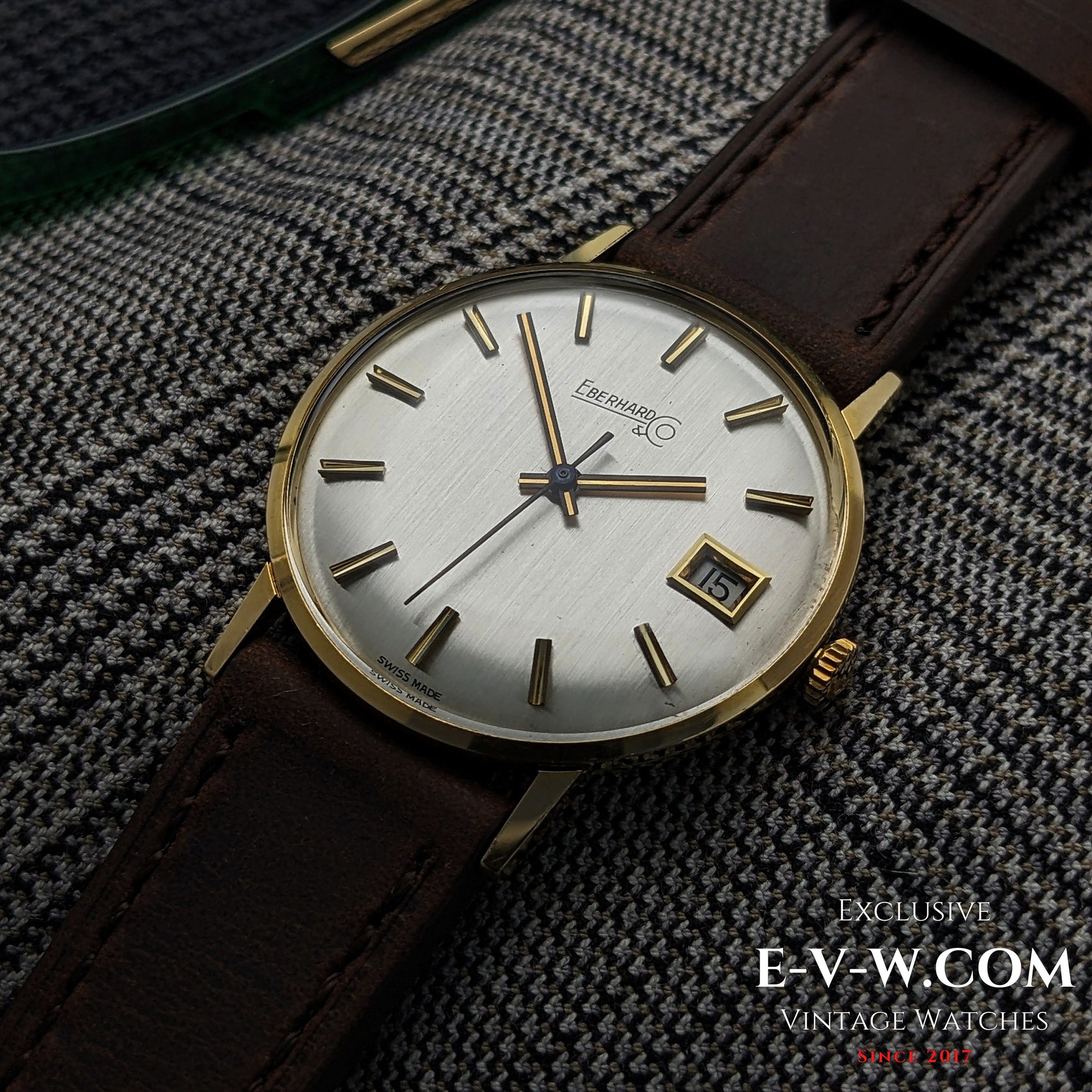 Eberhard &amp; Co. Armbanduhr aus 18-karätigem Gold aus den 1960er Jahren | Seltene Roulette-Datumsanzeige | Kal. 236-129 |