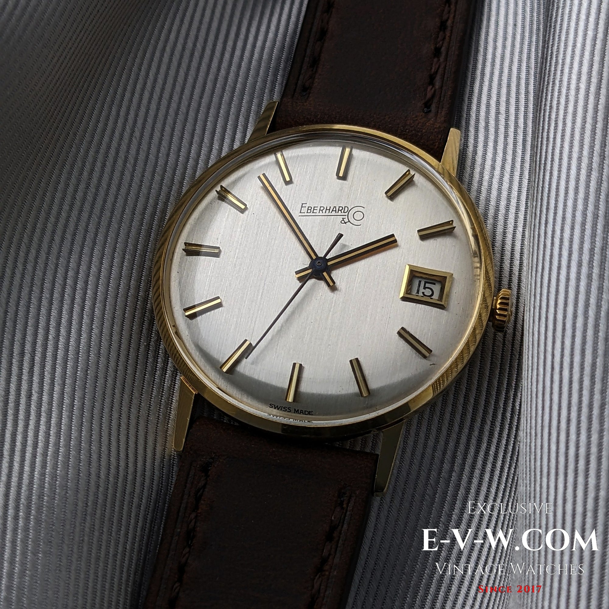 Eberhard &amp; Co. Armbanduhr aus 18-karätigem Gold aus den 1960er Jahren | Seltene Roulette-Datumsanzeige | Kal. 236-129 |