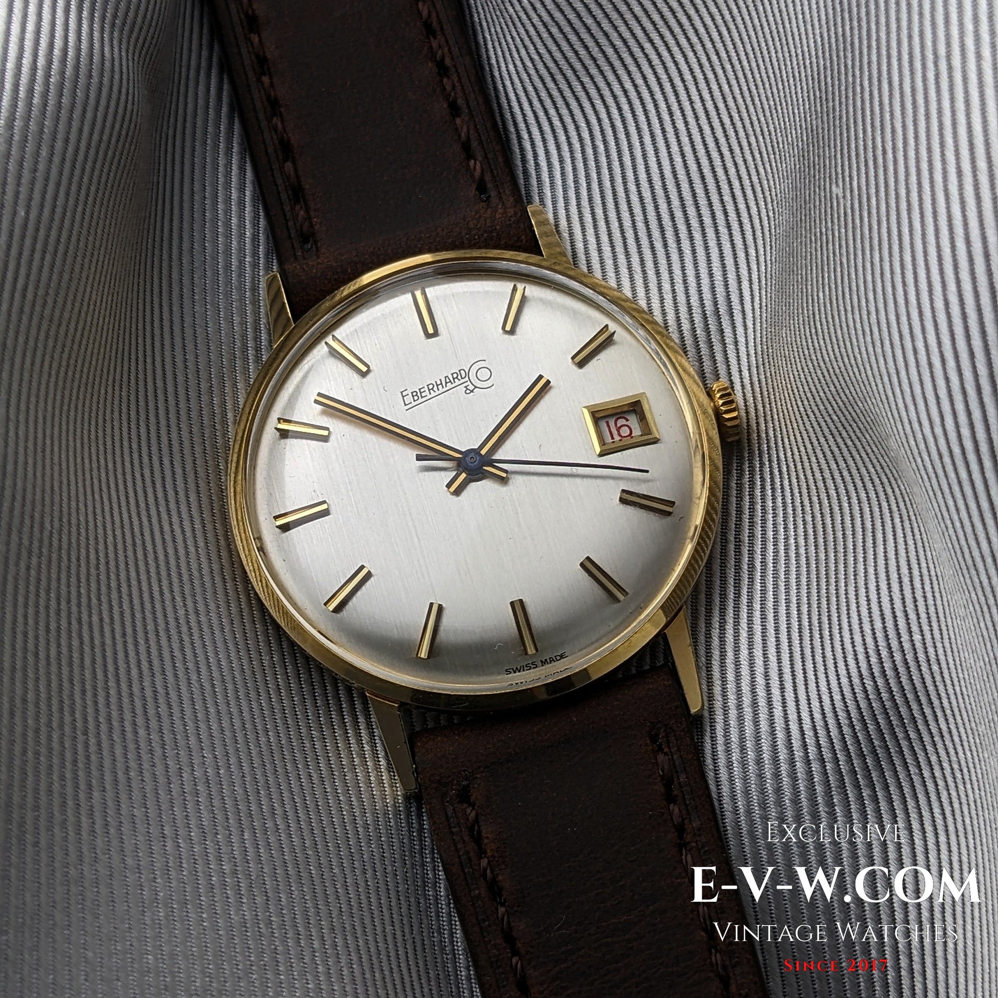 Eberhard &amp; Co. Armbanduhr aus 18-karätigem Gold aus den 1960er Jahren | Seltene Roulette-Datumsanzeige | Kal. 236-129 |