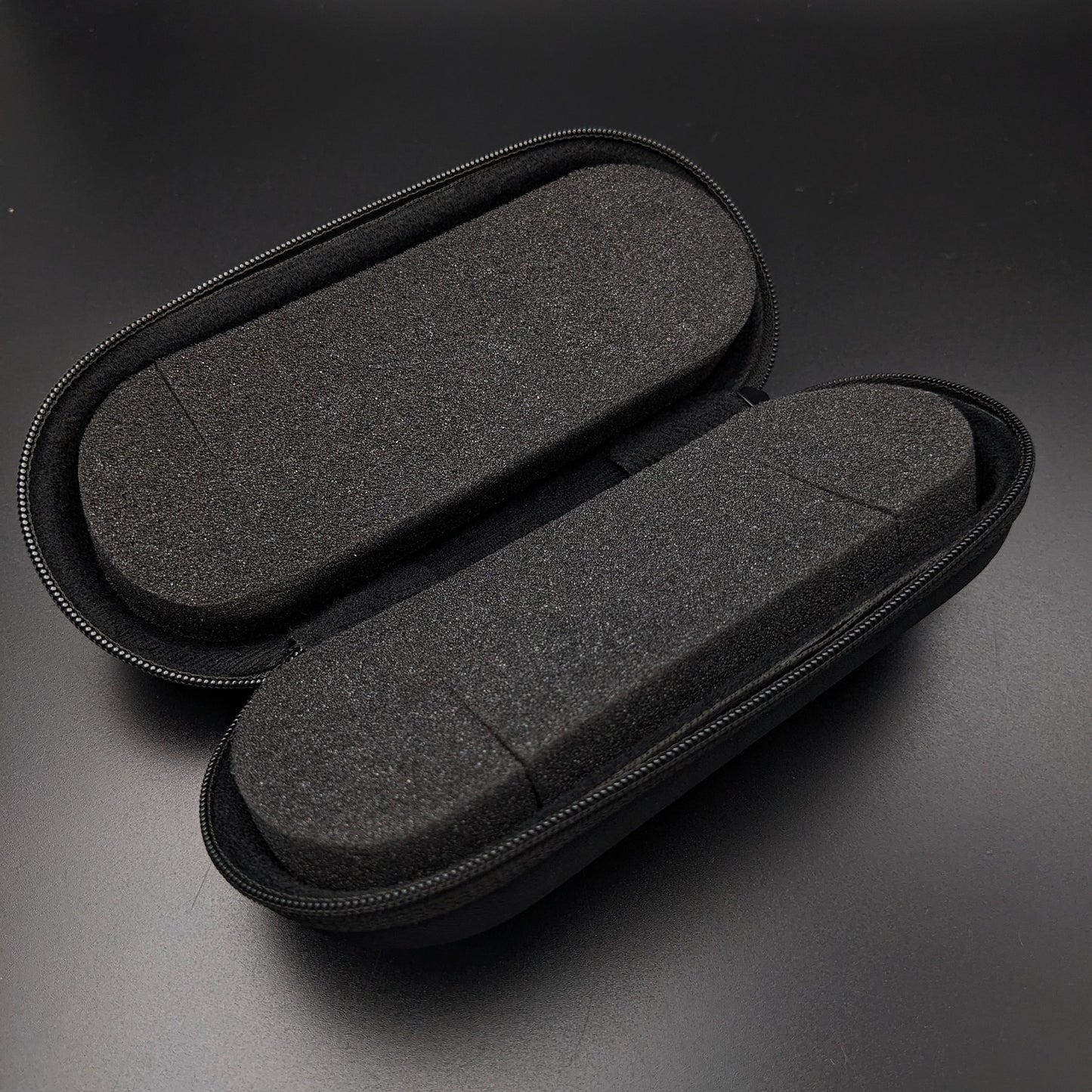 Protective black travel case with foam padding, designed for securely storing and transporting vintage wristwatches like the Omega Art Deco model.